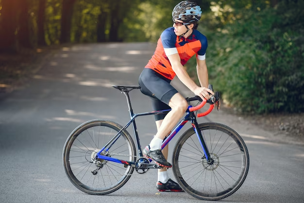 Cyclist in full biking gear from the side