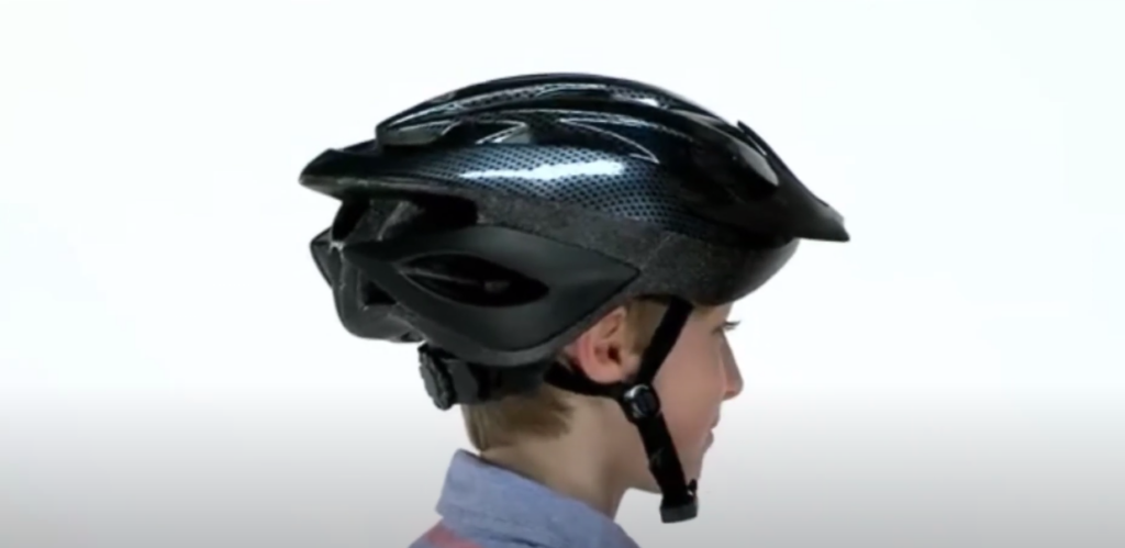 A kid with a Schwinn Beam LED Bike Helmet