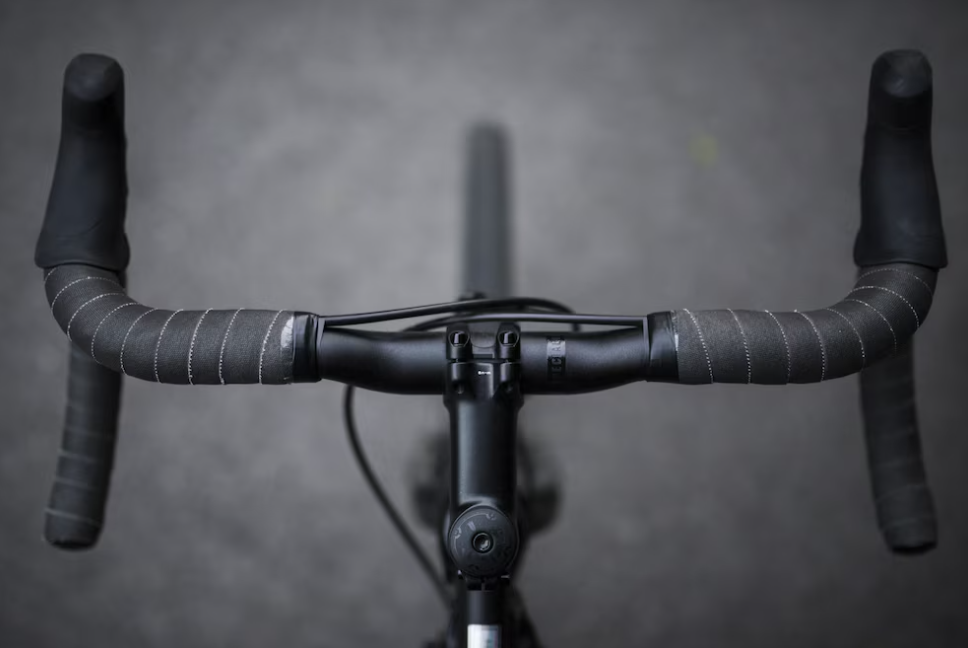 black handlebar and gray asphalt
